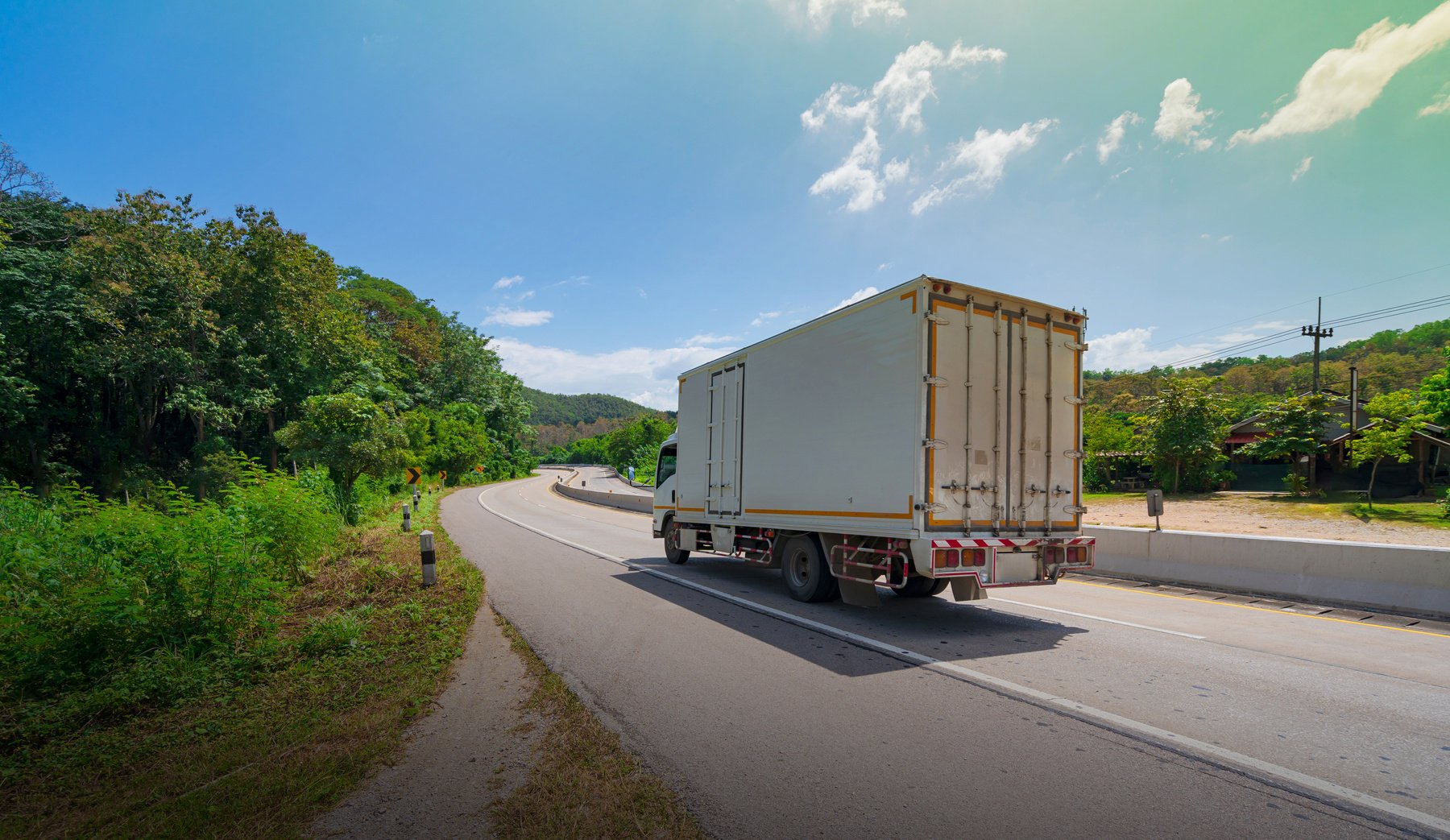 White Truck Driving on the Asphalt Road